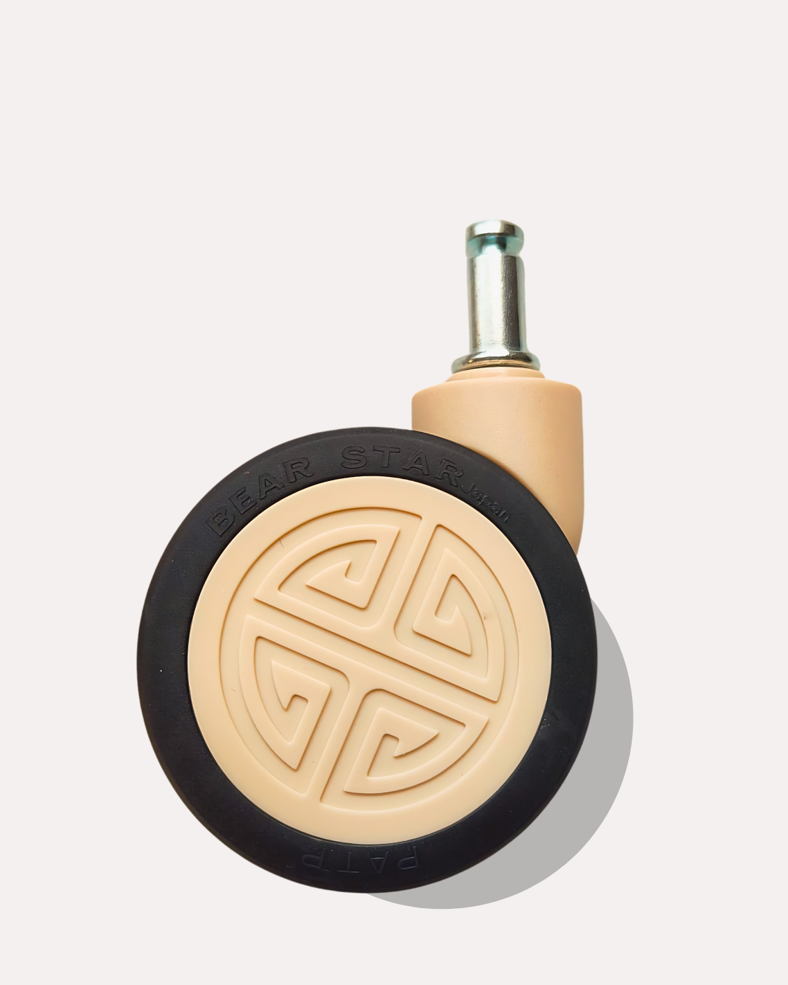 Caster wheel with beige base and black rubber wheel on a light gray background