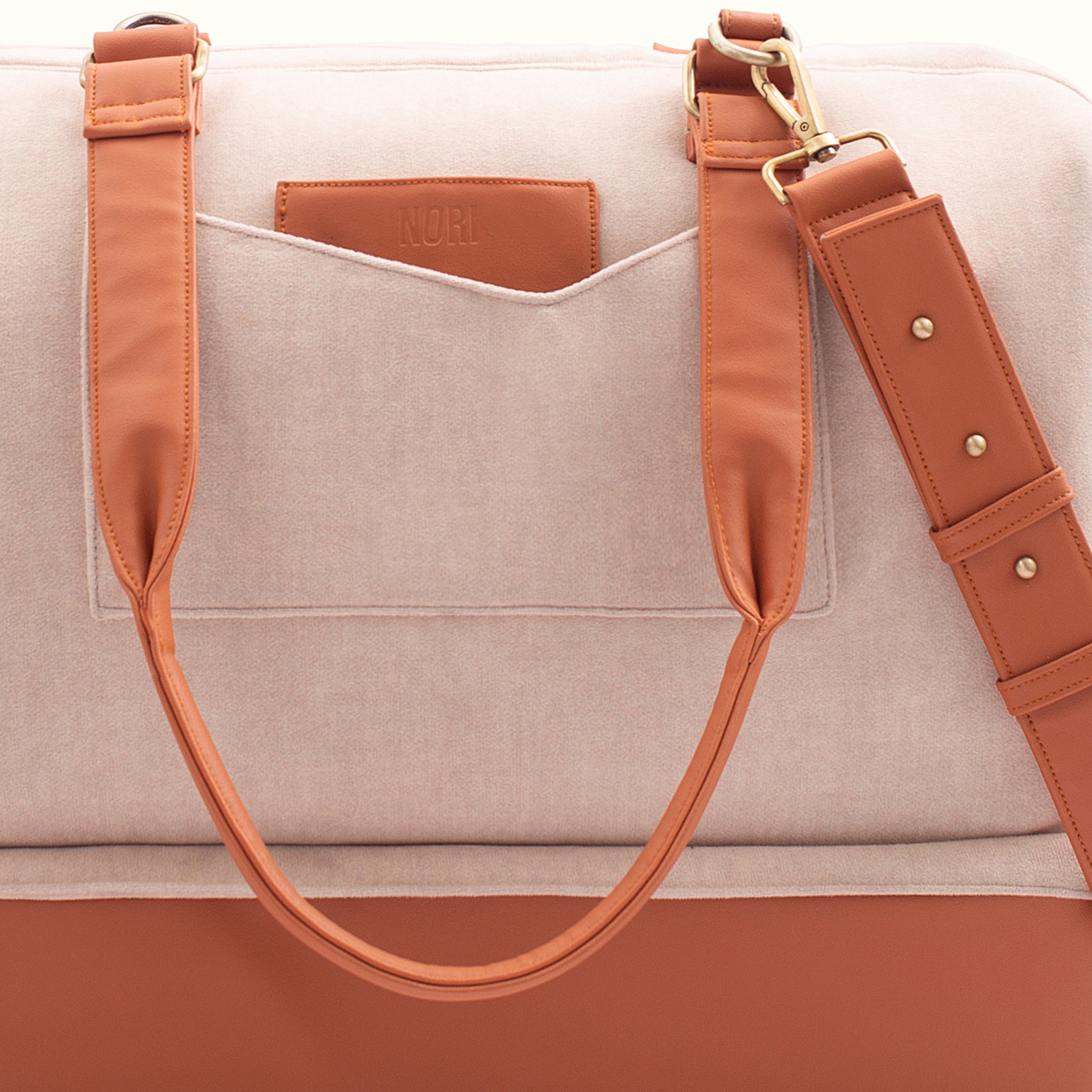 Polished metal accents + Quick access pockets